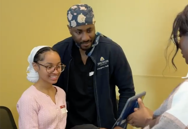 A doctor working with a mentee